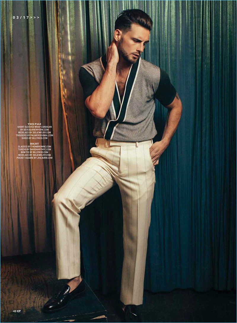 Embracing a retro vibe, Nico Tortorella dons a wrap cardigan by Deveaux with Palmiers du Mal trousers and Billy Reid shoes.