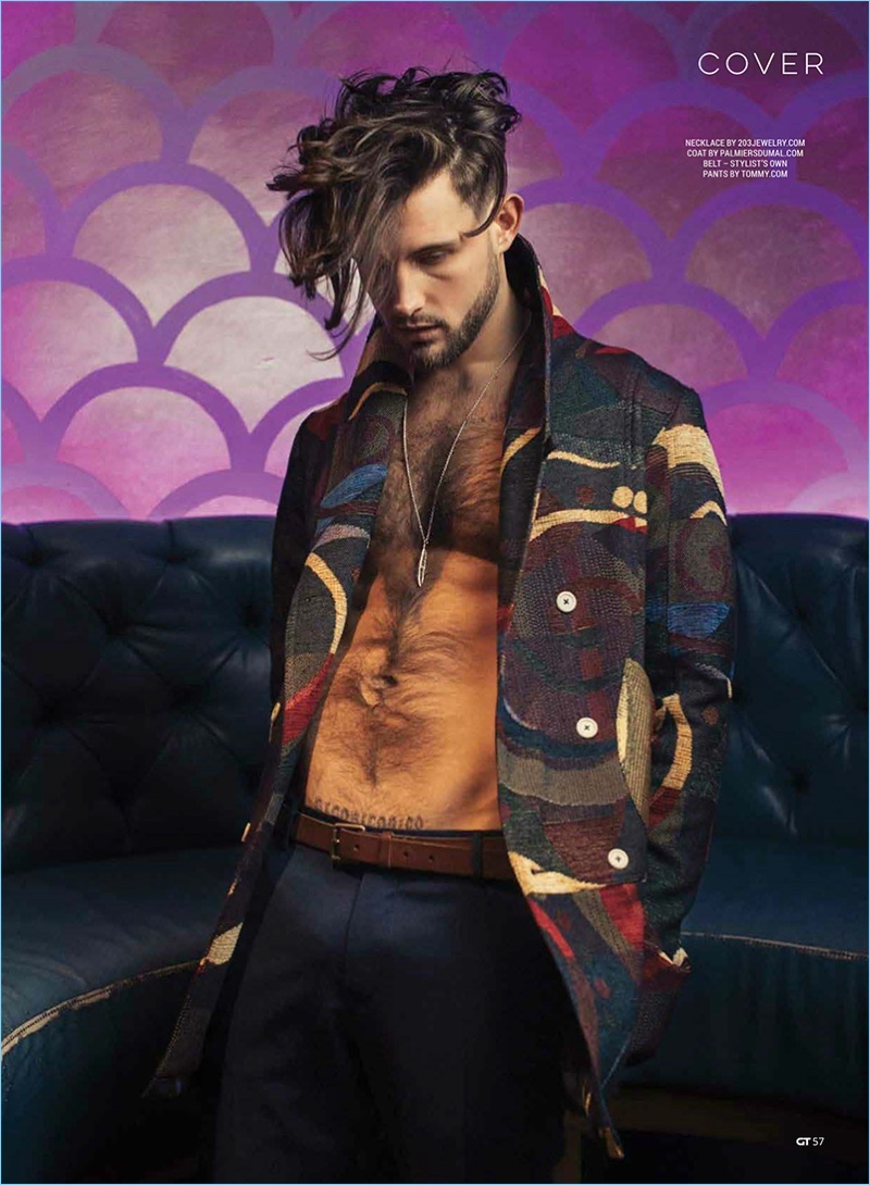 Appearing in a Gay Times photo shoot, Nico Tortorella wears a Palmiers du Mal coat with Tommy Hilfiger trousers.