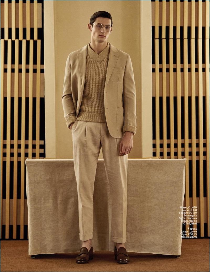 Embracing neutrals, Rhys Pickering models an Ermenegildo Zegna look with a Loewe sweater and H&M glasses.