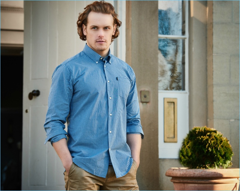 Sam Heughan wears a Barbour blue checked shirt $99 for the brand's spring-summer 2017 campaign.