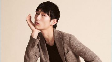 Starring in an editorial for Sleek magazine, Sang Woo Kim wears Giorgio Armani.