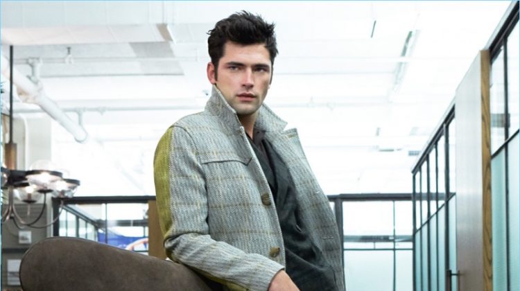 Starring in an editorial for GQ Russia, Sean O'Pry sports a Bally wool coat with a shirt and plaid suit by Etro. Sean also wears A.Testoni brown leather dress shoes.