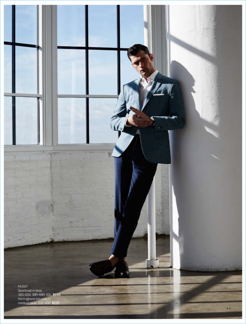 Christopher Campbell outfits Sean O'Pry in a HUGO by Hugo Boss blue sportcoat $645 and herringbone trousers $225.