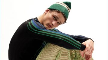Top of Your Game: Simon Nessman Dons Quirky Looks for VMAN Simon Nessman sports a Balmain sweater with Acne Studios shorts and vintage Vans sneakers.