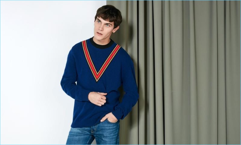 French model Vincent LaCrocq sports a Stella McCartney oversized cashmere and wool-blend sweater $935 in blue.