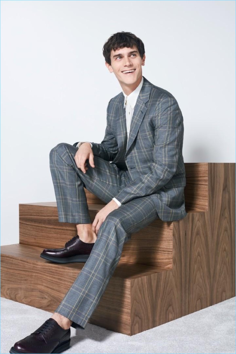 All smiles, Vincent LaCrocq wears a Stella McCartney grey slim-fit Prince of Wales checked wool suit jacket $1,590 and trousers $660.