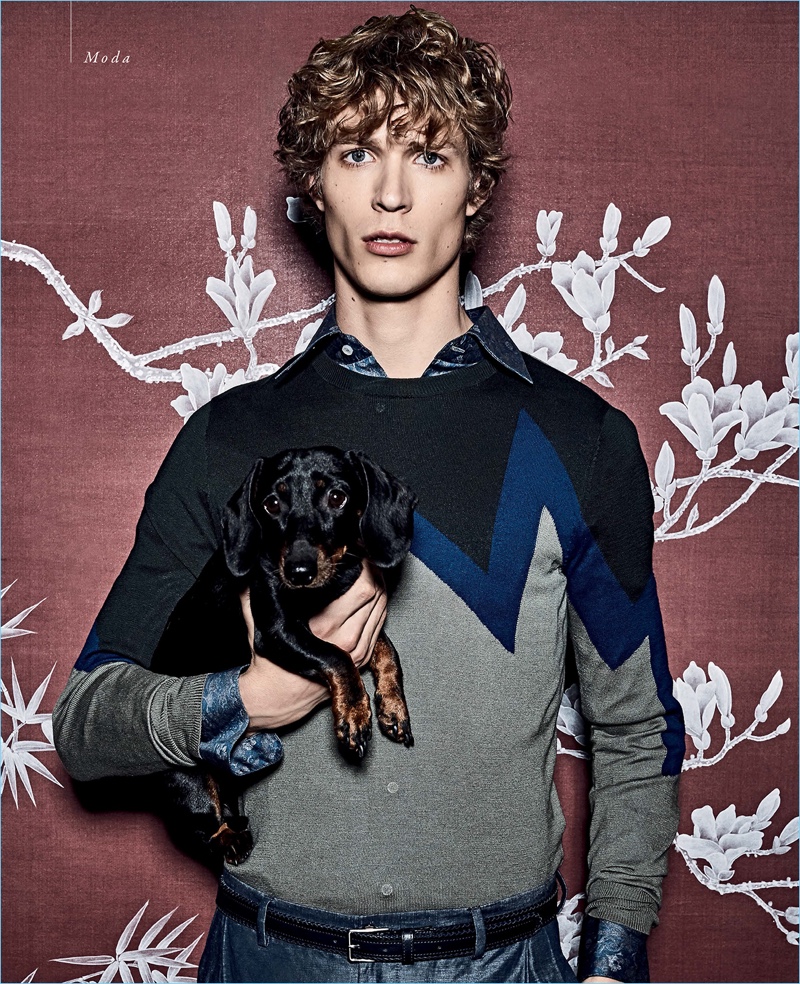 Luigi Gaballo outfits Sven de Vries in a sweater and trousers by Emporio Armani. Sven also wears an Italo Ferretti shirt with a Giorgio Armani belt.