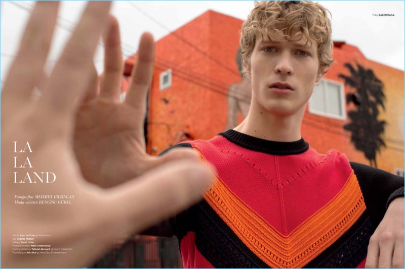 Model Sven de Vries dons a colorful sweater by Balenciaga.