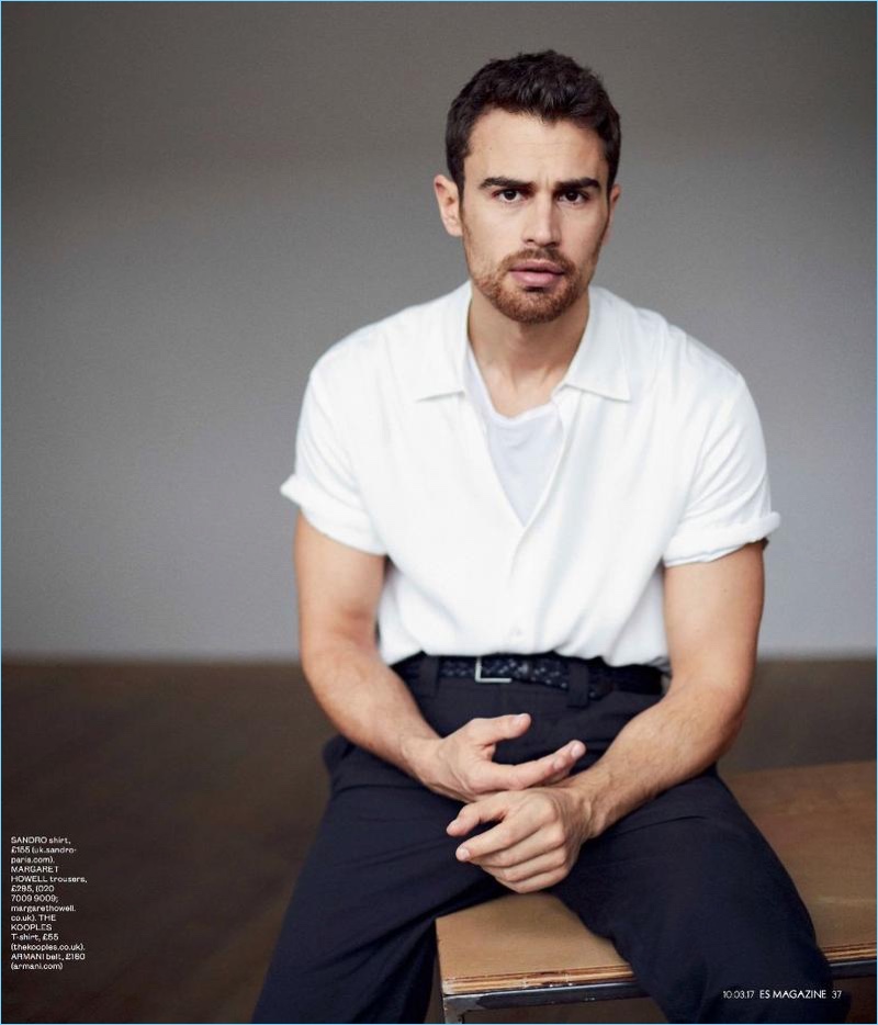 Theo James wears a Sandro shirt, Armani belt, and The Kooples t-shirt with Margaret Howell trousers.