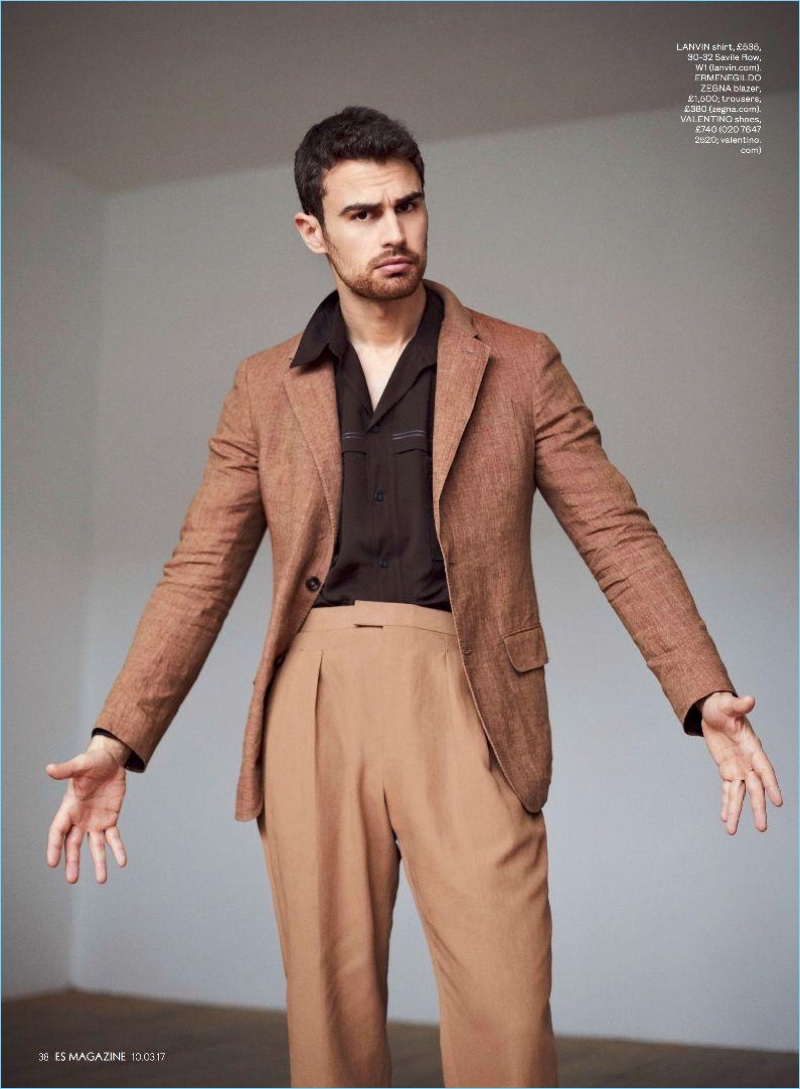 Front and center, Theo James sports a Lanvin shirt with an Ermenegildo Zegna blazer and trousers.