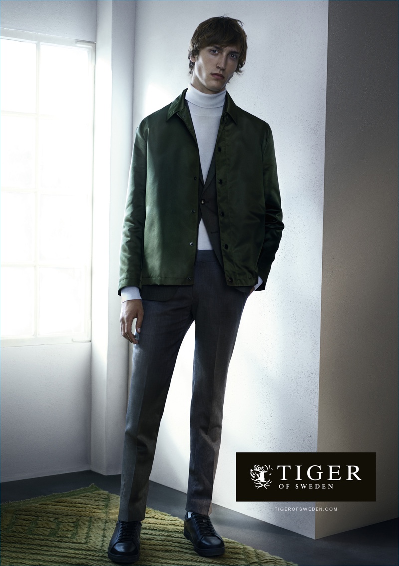 Model Tim Dibble dons a nylon satin jacket $450 with suiting for Tiger of Sweden's spring-summer 2017 campaign.