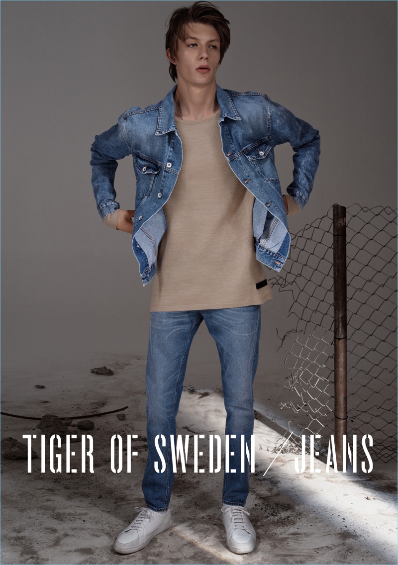 Finnlay Davis sports a denim jacket and oversized top with Tiger of Sweden blue slim jeans $270.