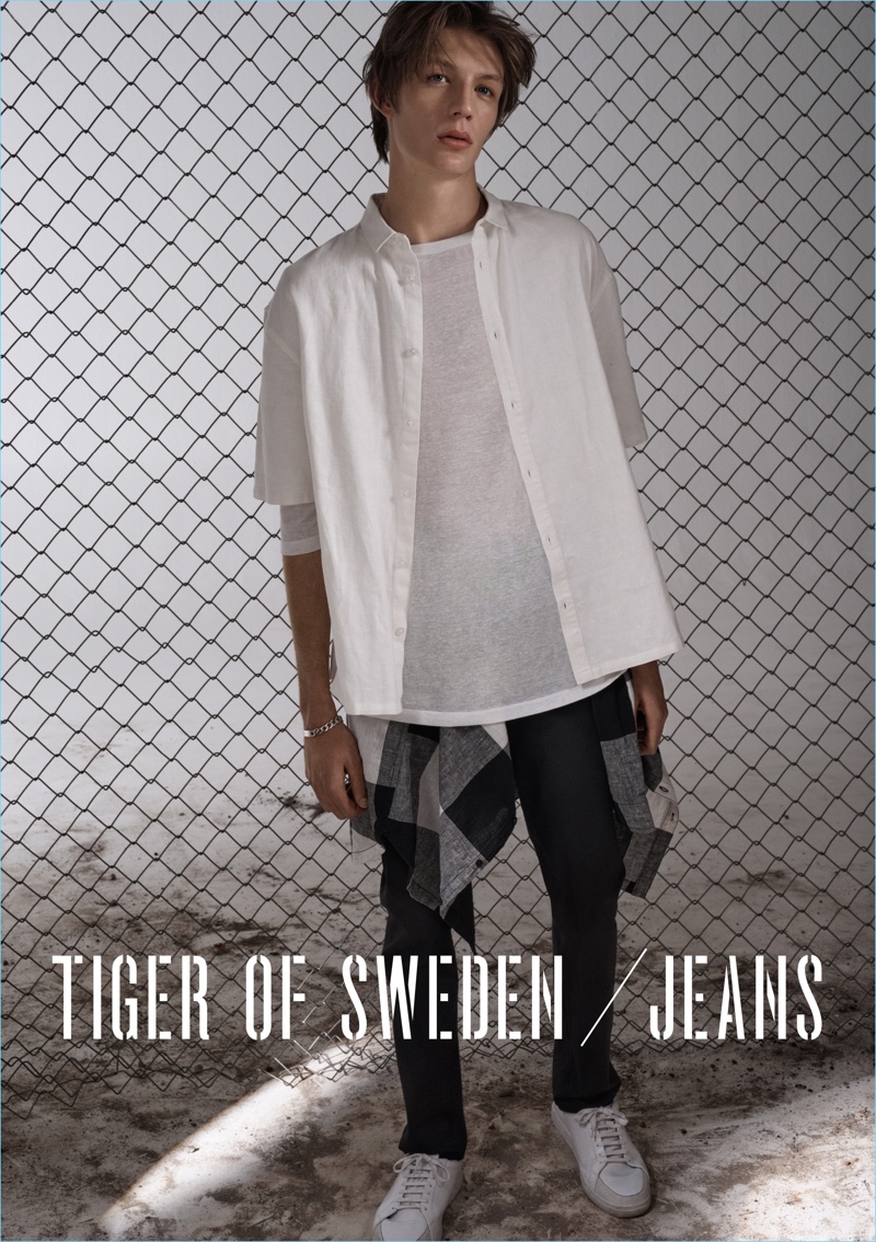 Starring in Tiger of Sweden Jeans' spring-summer 2017 campaign, Finnlay Davis wears the brand's black slim jeans $200.