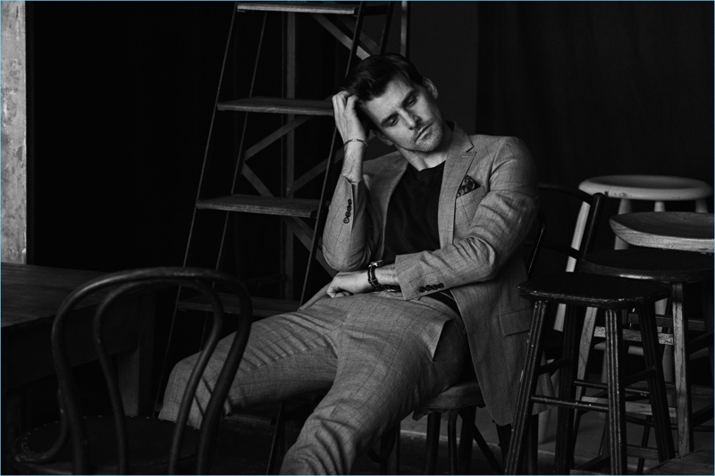 Sitting for a black and white photo, Johannes Huebl fronts Todd Snyder's Well Suited campaign.