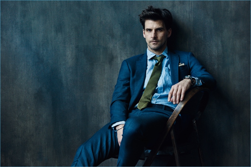 Wearing a navy suit, Johannes Huebl stars in Todd Snyder's Well Suited campaign.
