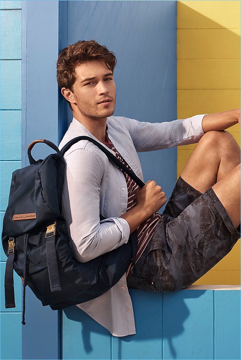 Cool and Tonal: Francisco Lachowski wears a Tommy Hilfiger striped tee $49.50, floral print shorts $99.50, and a slim-fit bib shirt $99.50.