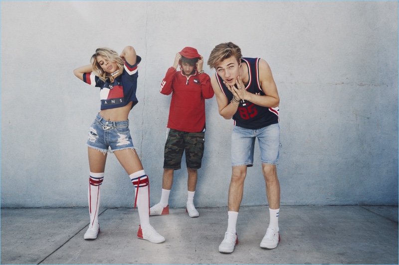 Sofia Richie, Anwar Hadid, and Lucky Blue Smith star in Tommy Jeans’ spring-summer 2017 campaign. Anwar wears a Tommy Jeans red hooded jacket $199.50, camo shorts $119.50, and signature sneakers $99.50. Meanwhile, Lucky models a Tommy Jeans basketball tank $99.50 and denim carpenter shorts $119.50 with signature sneakers $99.50.