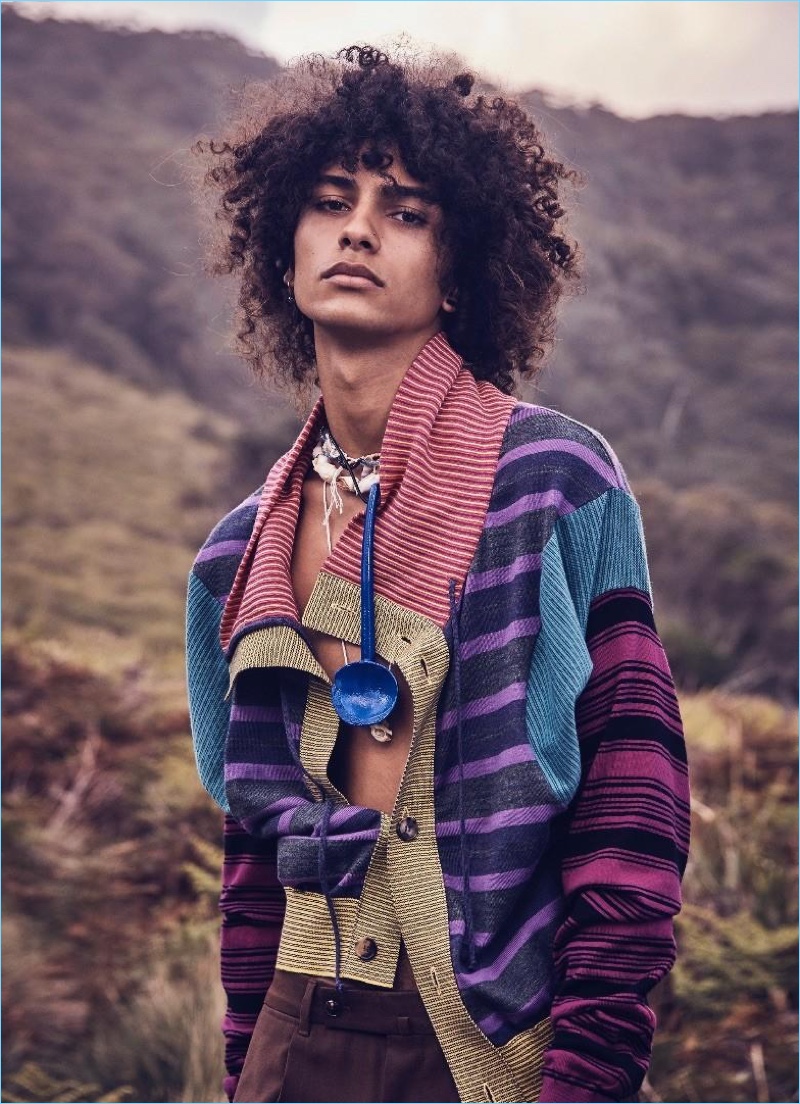 Making a colorful striped statement, Trè Samuels sports a wool cardigan and pendant necklace by Loewe with Ermenegildo Zegna wool pants.