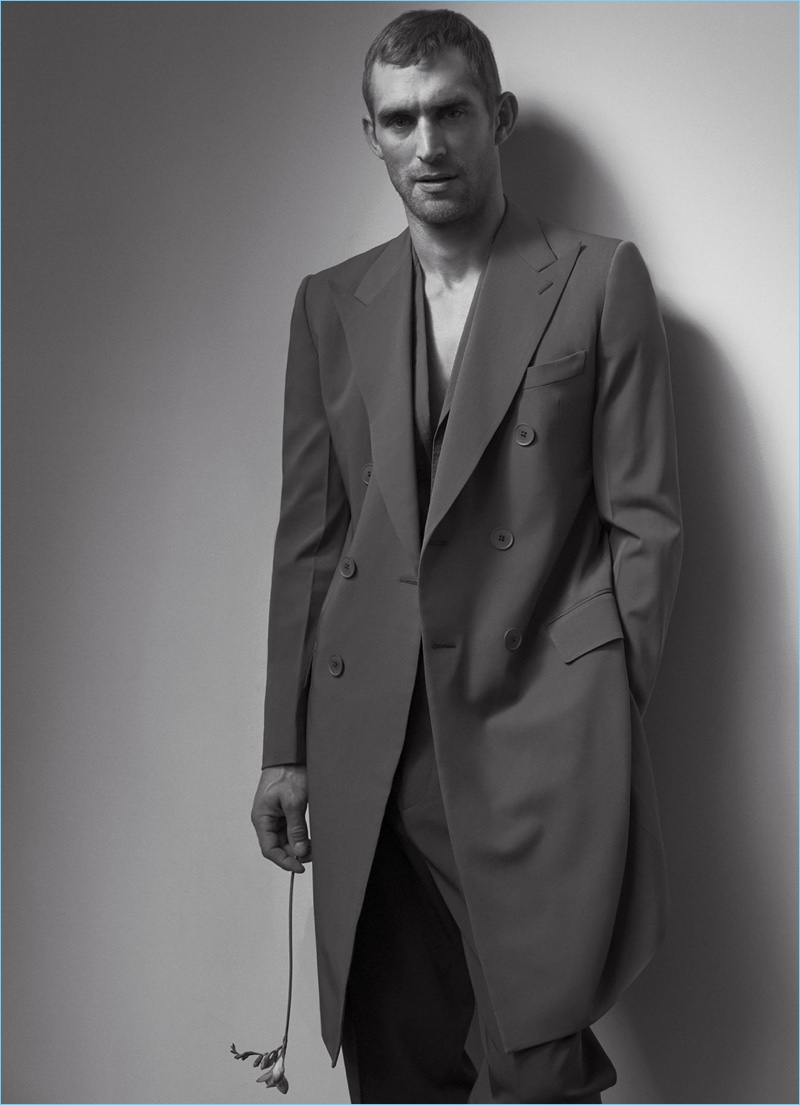Will Chalker models a double-breasted coat and suit by Bottega Veneta.