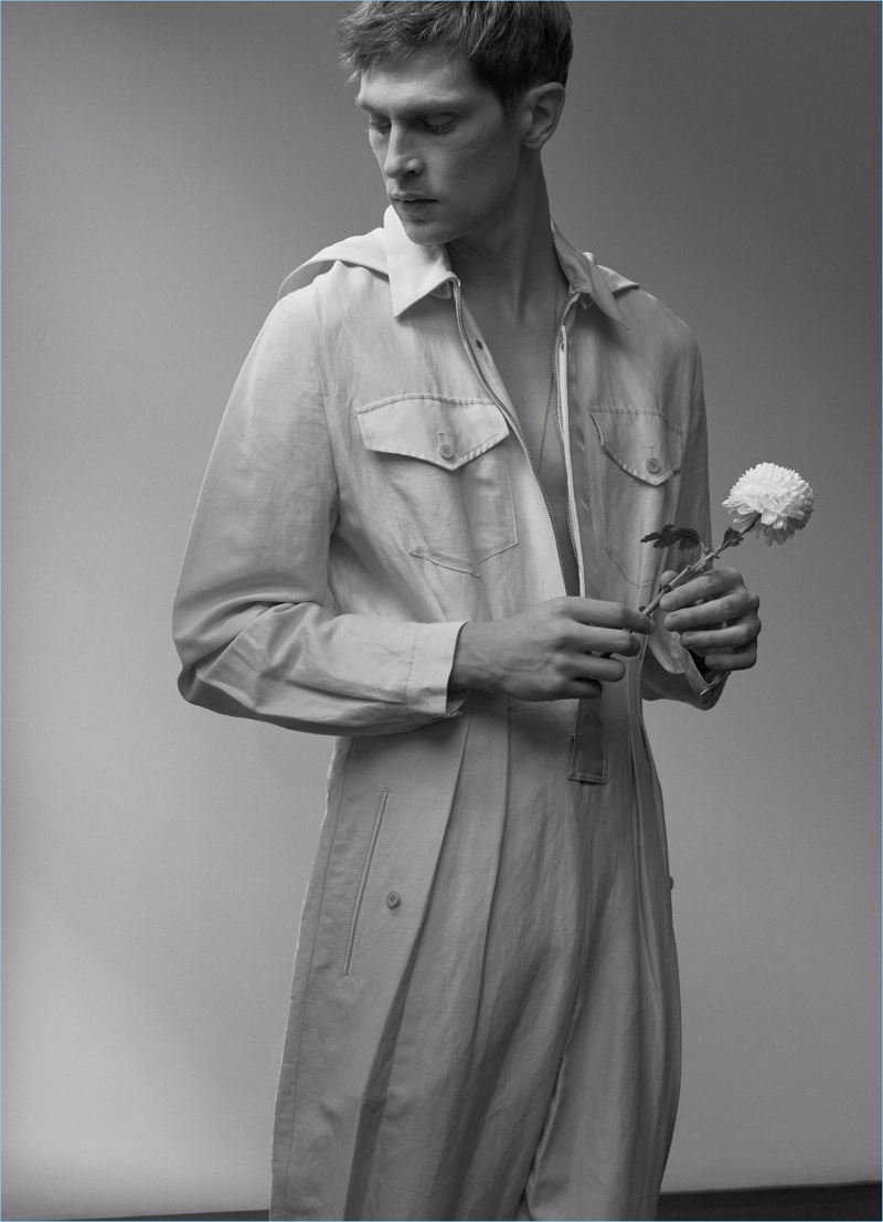 Mathias Lauridsen dons a J.W. Anderson jumpsuit with a Title of Work necklace.