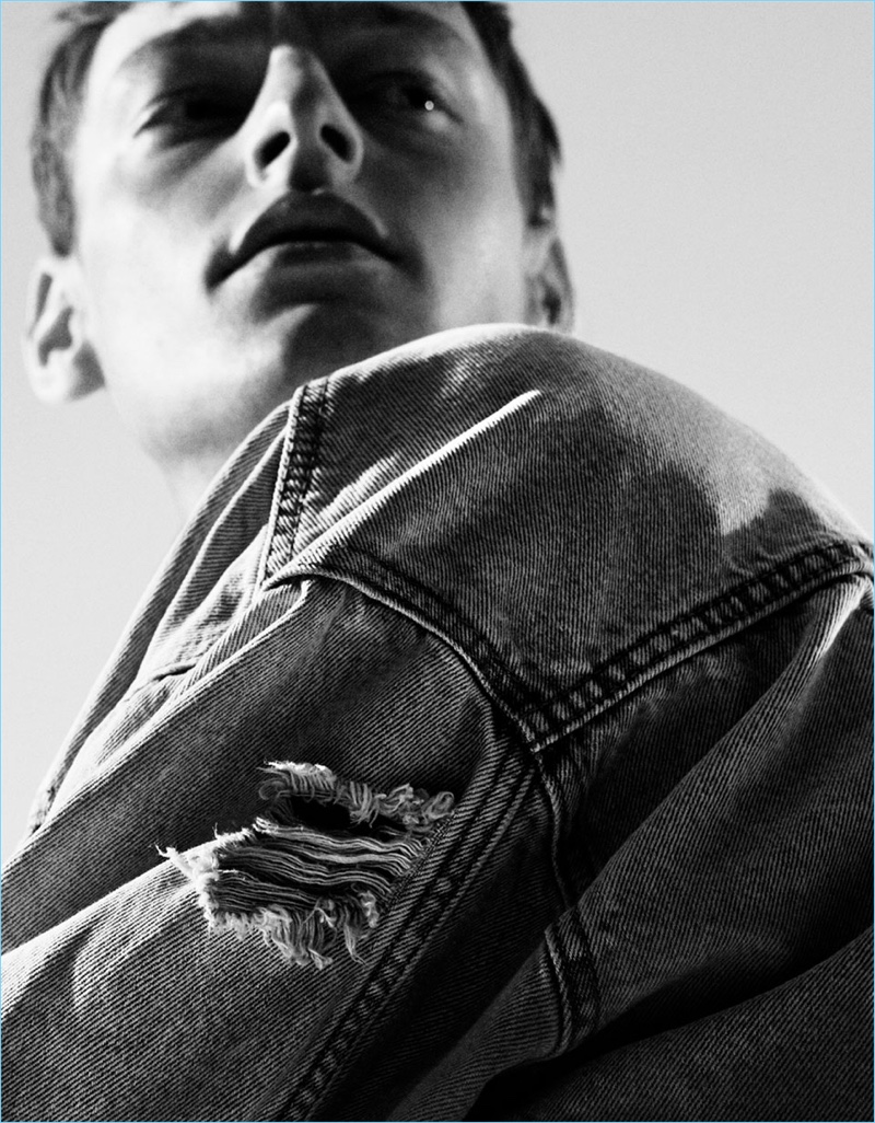 Roberto Sipos models a ripped denim overshirt from Zara Man.