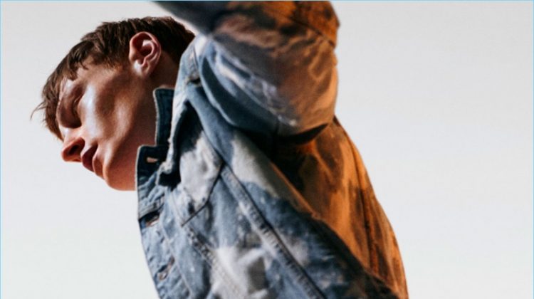 Bleached denim is on trend as Roberto Sipos models Zara Man's denim jacket and jeans.