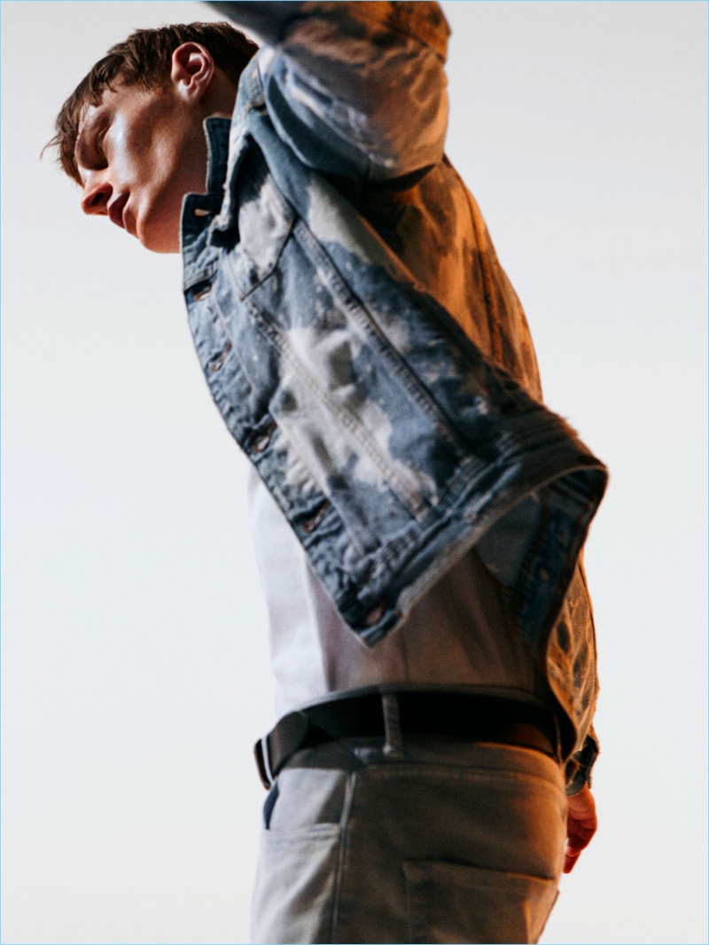 Bleached denim is on trend as Roberto Sipos models Zara Man's denim jacket and jeans.