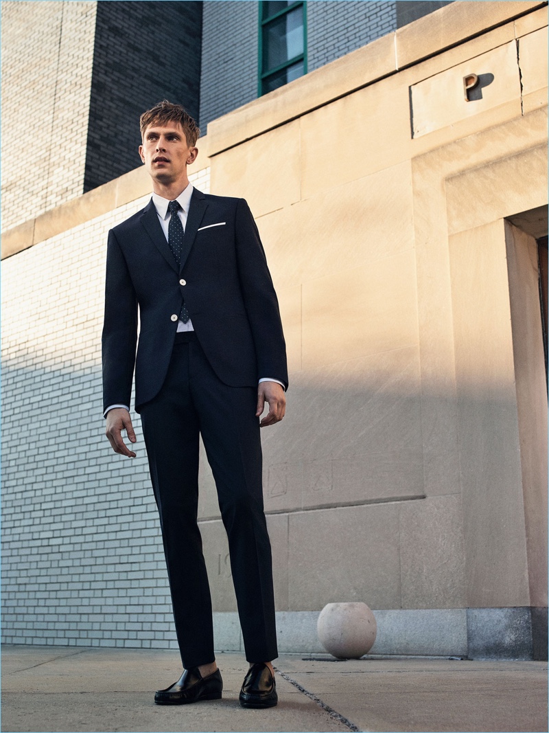 Connecting with Zara Man, Mathias Lauridsen wears a classic suit with a polka dot tie and leather loafers from Zara Man.