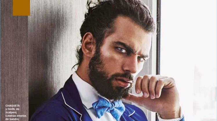 Delivering a fierce gaze, Spyros Christopoulos wears a jacket and cummerbund by Scalpers. Spyros also models a Sandro shirt, and Bowtie bow-tie.