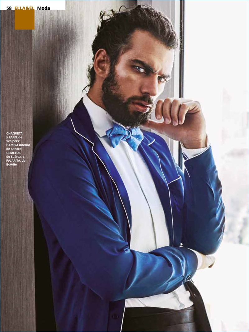 Delivering a fierce gaze, Spyros Christopoulos wears a jacket and cummerbund by Scalpers. Spyros also models a Sandro shirt, and Bowtie bow-tie.