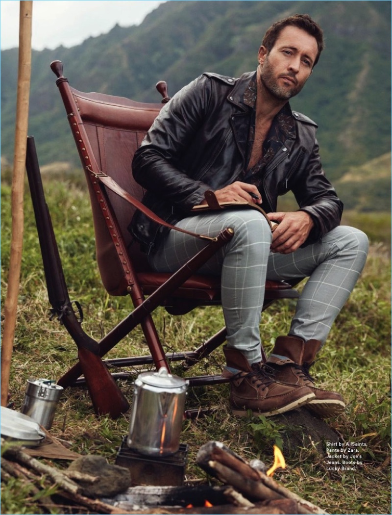 Relaxing outdoors, Alex O'Loughlin sports an AllSaints shirt with Zara windowpane print trousers. He also wears a Joe's Jeans leather biker jacket and Lucky Brand boots.