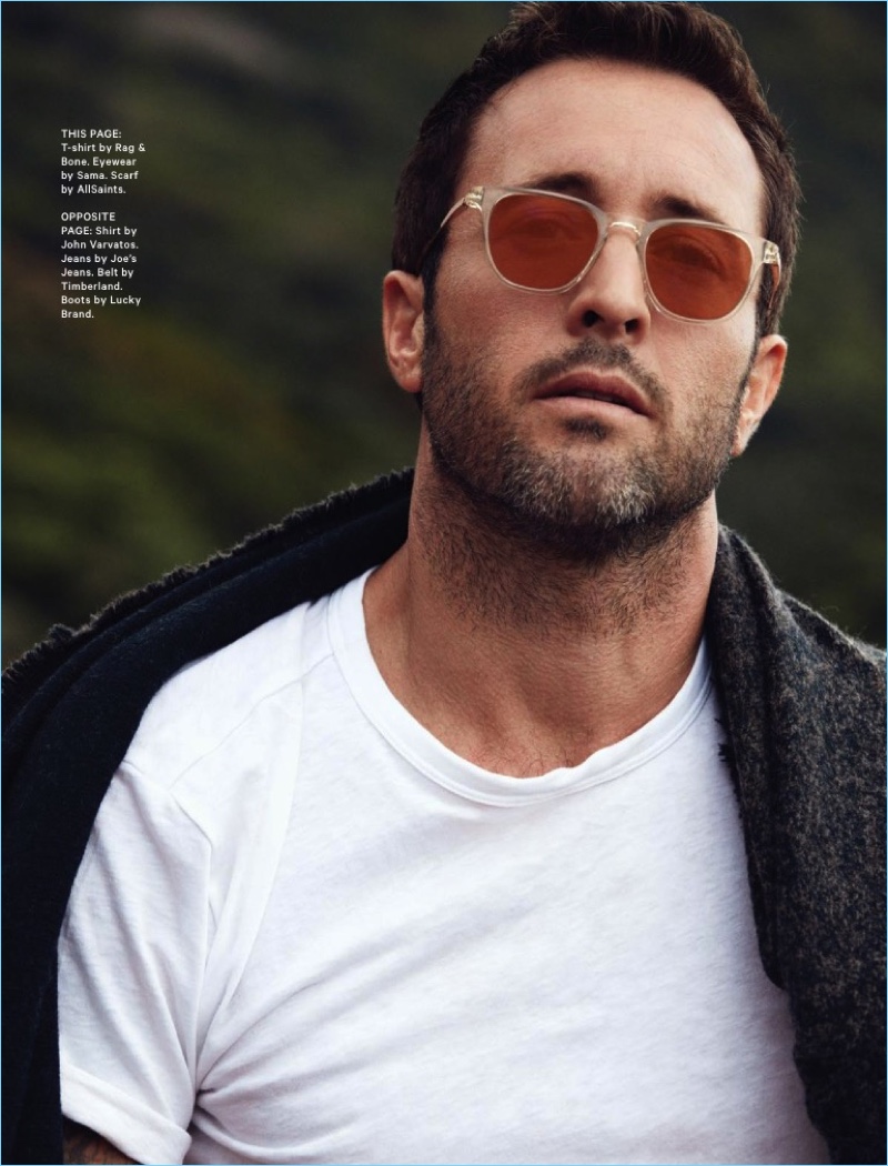 A cool vision, Alex O'Loughlin wears a Rag & Bone t-shirt with Sama sunglasses and an AllSaints scarf.