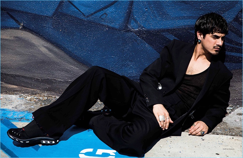 Starring in a Da Man photo shoot, Avan Jogia wears a black look by Givenchy.