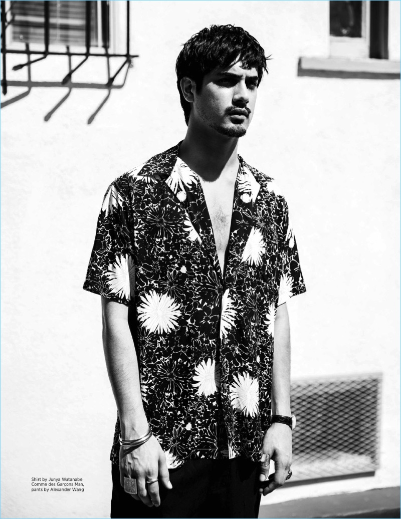 Appearing in a black and white photo, Avan Jogia wears a Junya Watanabe shirt with Alexander Wang pants.