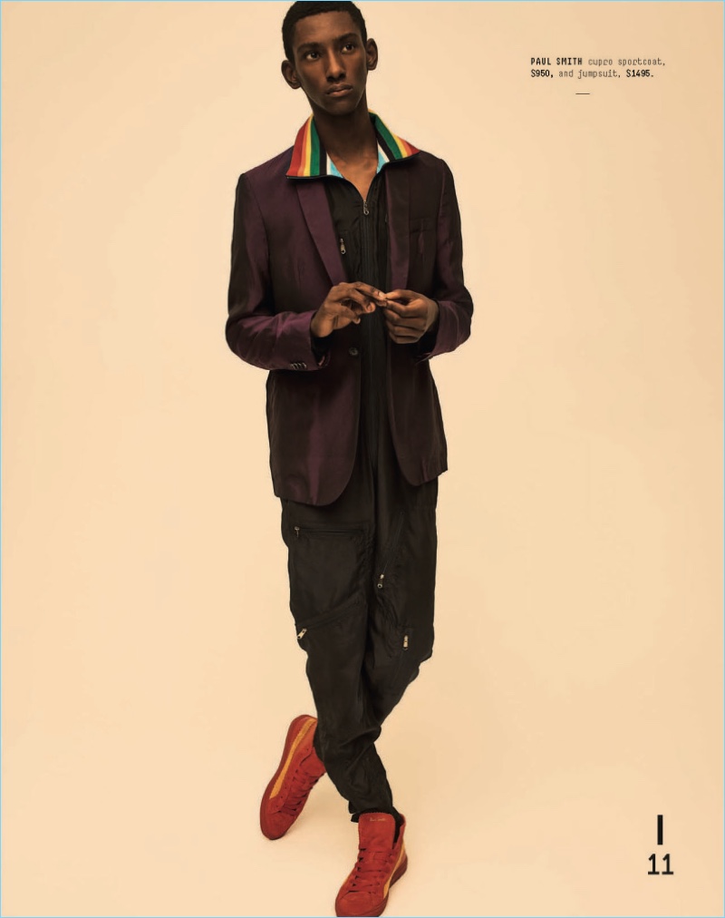 Making quite the statement, Myles Dominique sports a Paul Smith jumpsuit and sport coat.