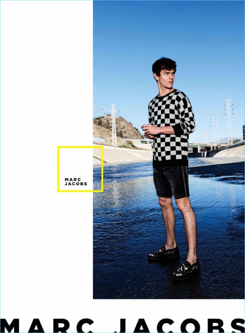 Connecting with Bloomingdale’s, Vincent LaCrocq rocks a Marc Jacobs checkerboard print sweater $540 and satin suiting shorts $495.