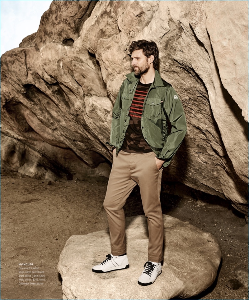 Bloomingdale's taps RJ Rogenski to model a look by Moncler. RJ rocks a Moncler coach's jacket $545 with a camo print t-shirt $405. He also wears khaki chinos $345.