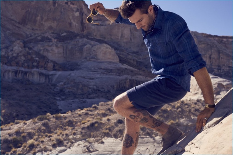 Model Rafael Lazzini sports a plaid shirt with shorts from Bonobos' spring-summer 2017 collection.