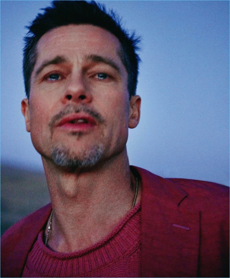 Fighting back tears, Brad Pitt dons a suit jacket and sweater by Bottega Veneta with a David Yurman necklace.