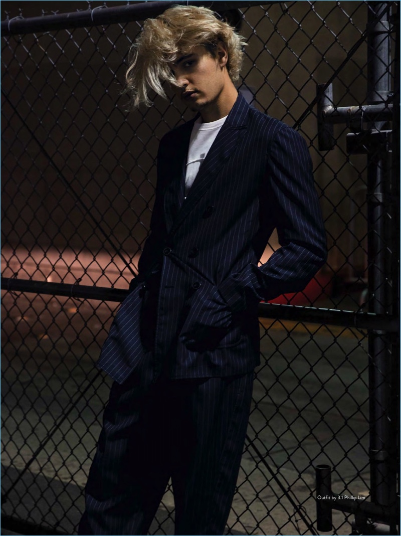 Sporting a sleek pinstripe suit and graphic t-shirt, Brandon Lee wears 3.1 Phillip Lim.