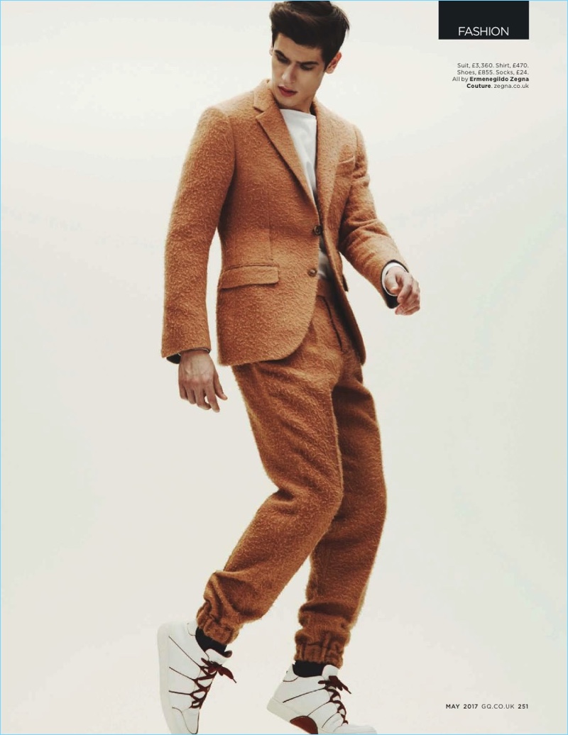 Making a textured statement, Victor Oliveira wears a brown look with sneakers from Ermenegildo Zegna Couture.