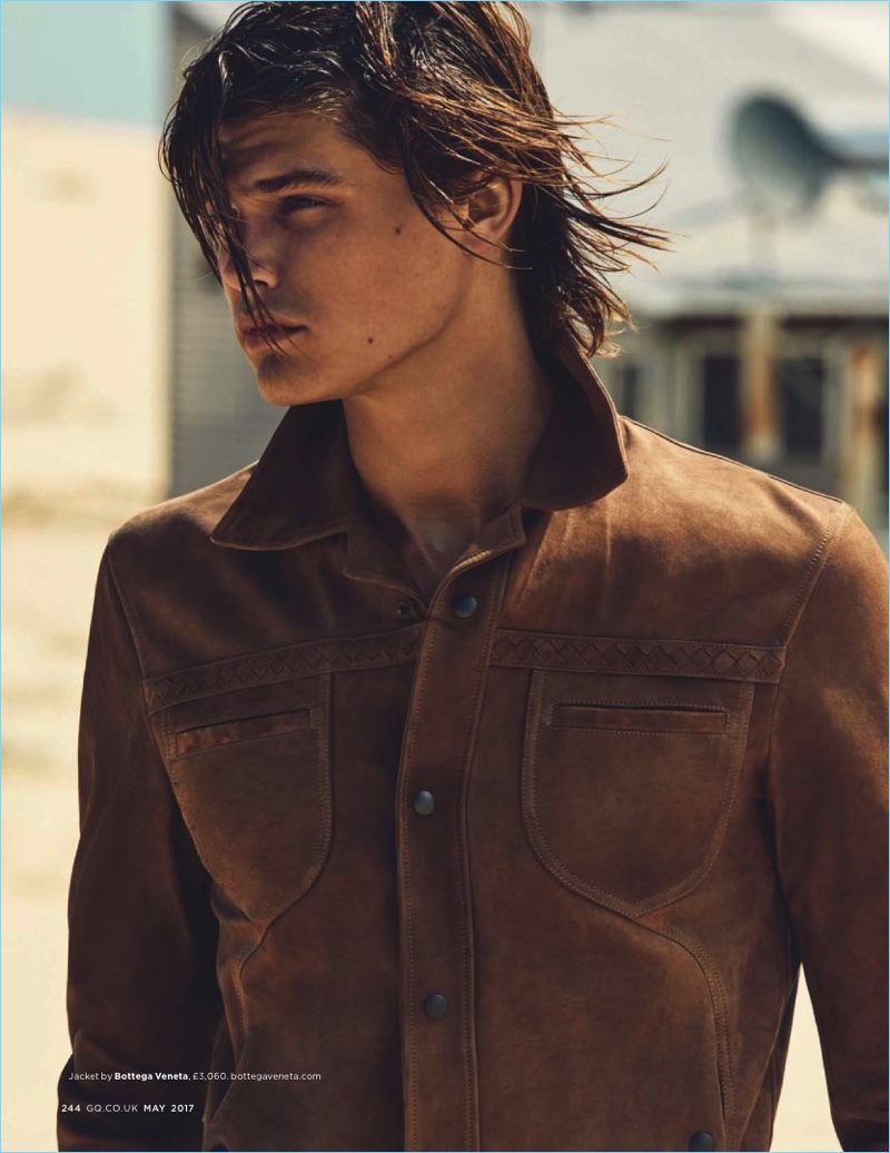 A rich vision in brown, Jesse Gwin wears a Bottega Veneta jacket.