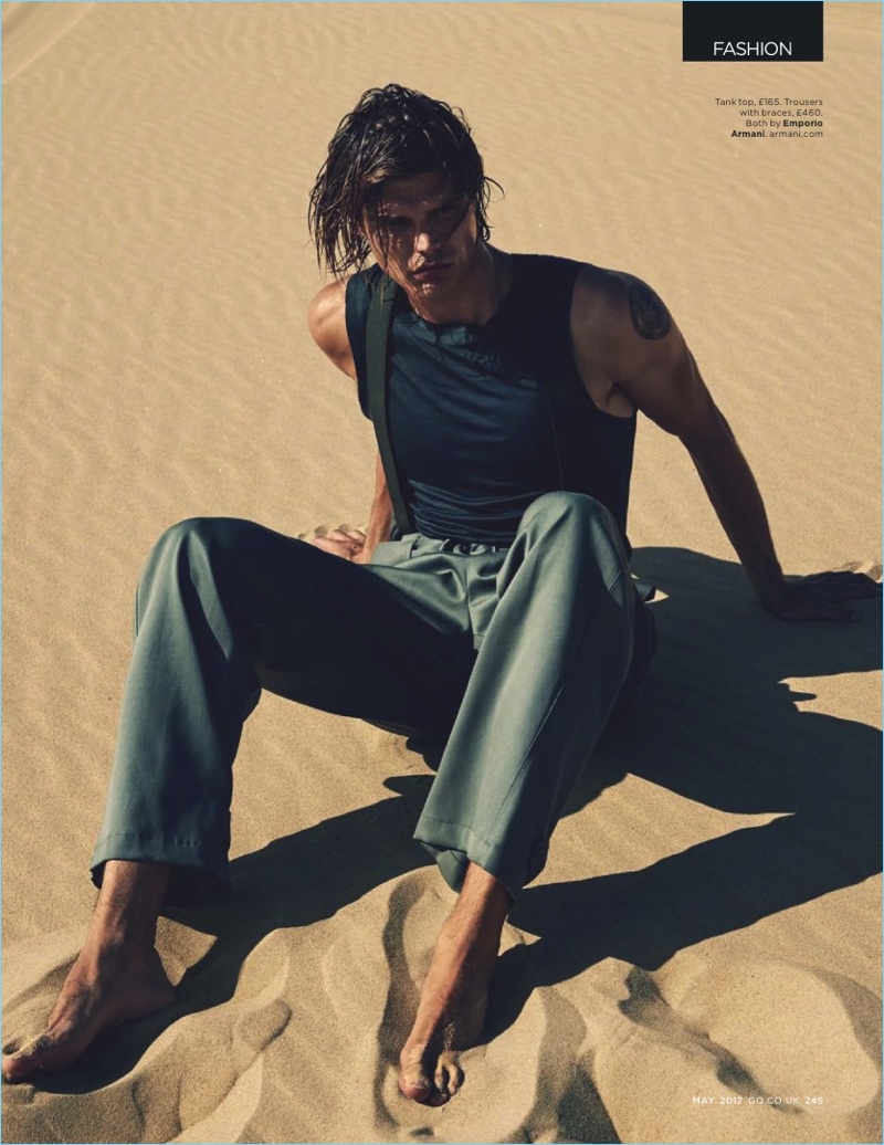 Nick Leary photographs Jesse Gwin in a tank, trousers, and suspenders by Emporio Armani.