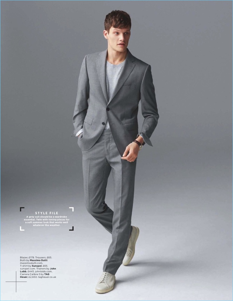 British model Danny Beauchamp wears a grey Massimo Dutti suit with a Sunspel t-shirt and John Lobb sneakers.