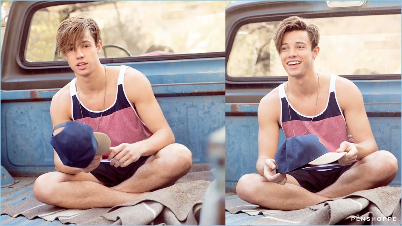 Sitting in the back of a pickup truck, Cameron Dallas wears a color blocked tank and shorts for Penshoppe's spring-summer 2017 campaign.