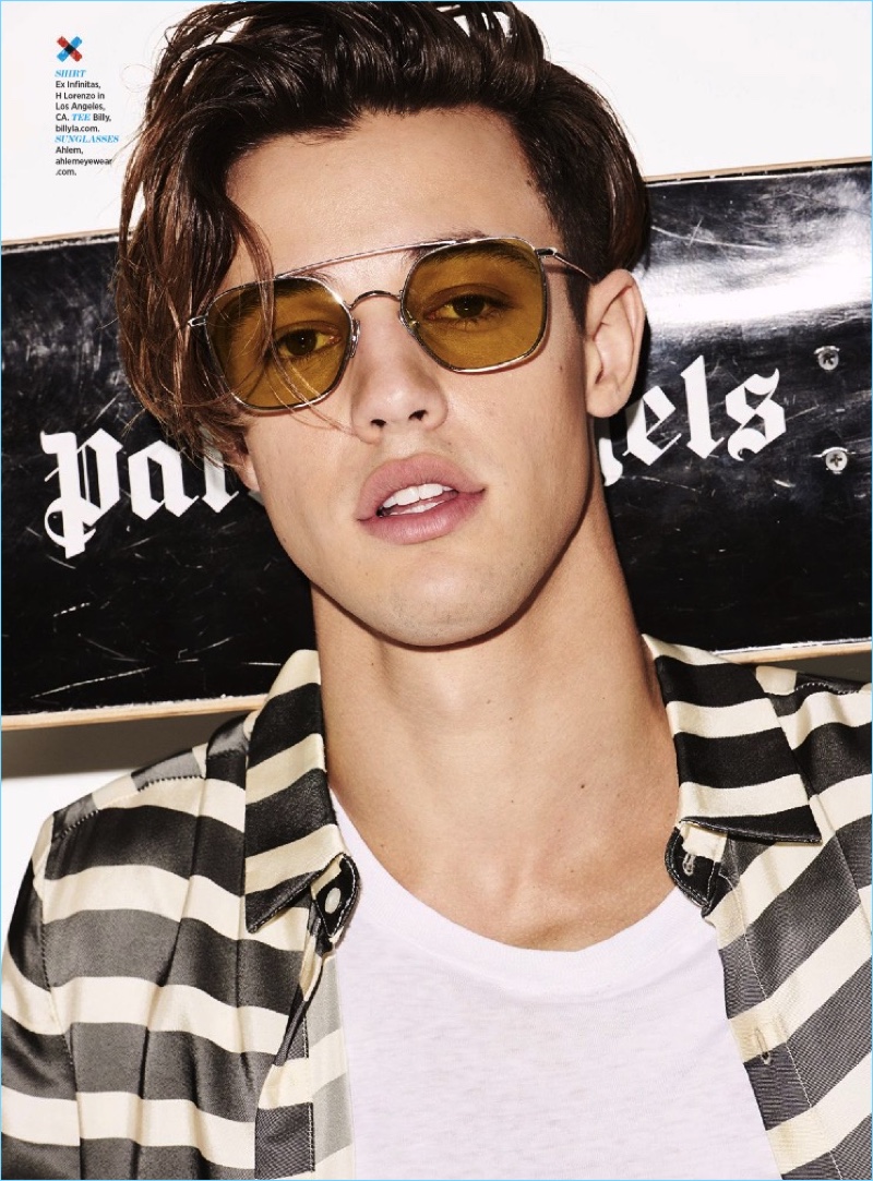 Rocking Ahlem sunglasses, Cameron Dallas also wears an Ex Infinitas shirt.