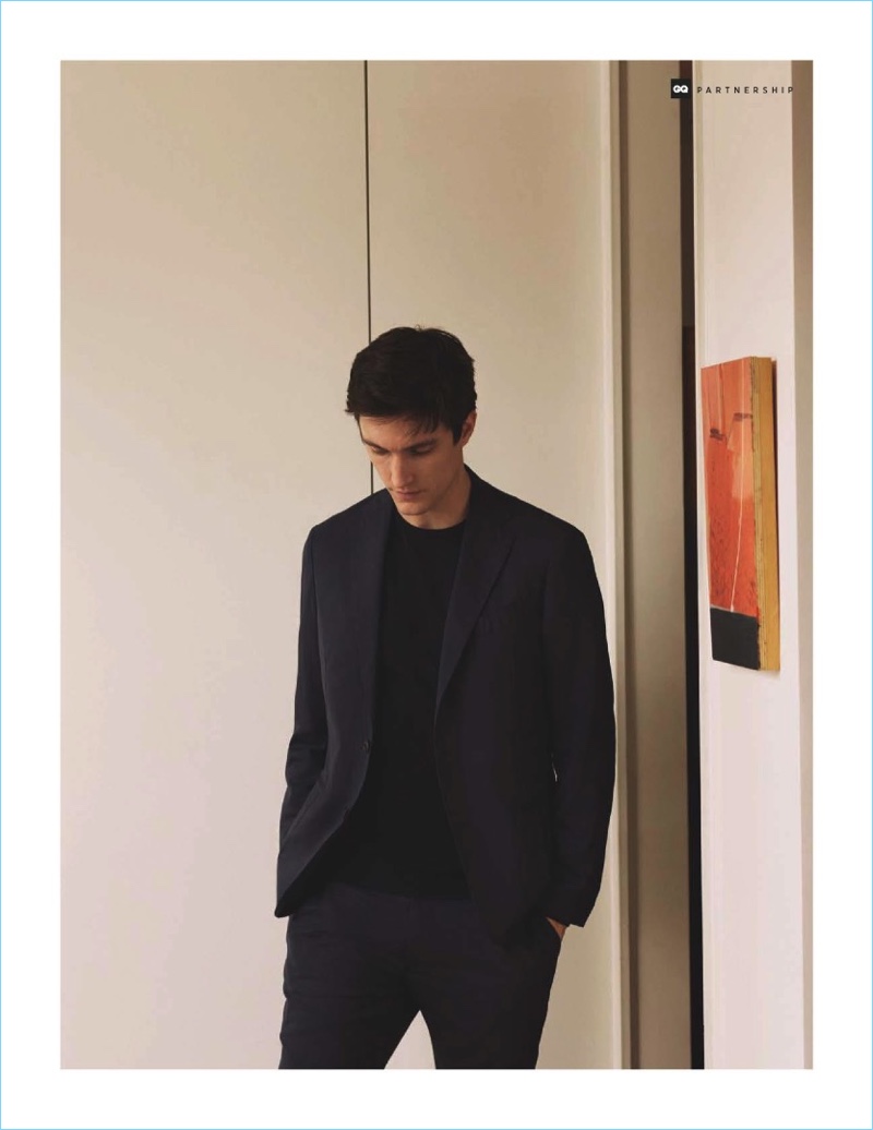 A clean vision, Charlie Timms models a simple suit with a sweater by Massimo Dutti.