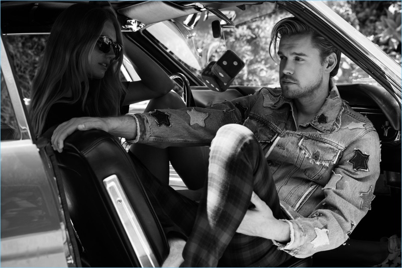 Relaxing in a car, Chord Overstreet rocks a Faith Connexion denim jacket with check Topman pants.