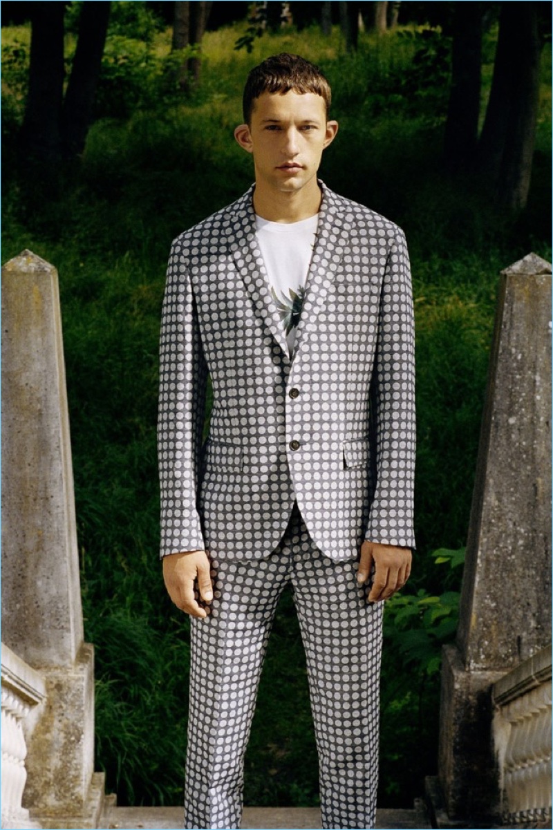 Front and center, Leo Topalov wears a dot print suit from Christian Lacroix's spring-summer 2017 collection.