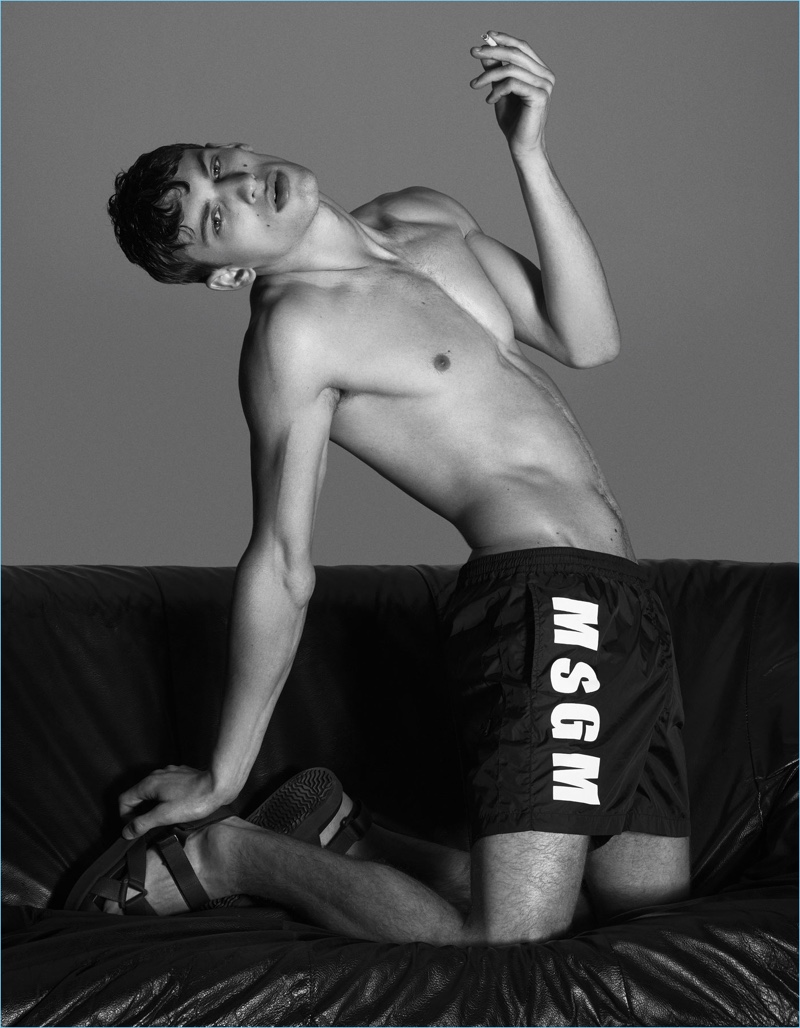Emilio Tini photographs David Trulik in shorts and sandals by MSGM.